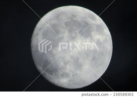 Full Moon Illuminated Against a Dark Night Sky 130589301
