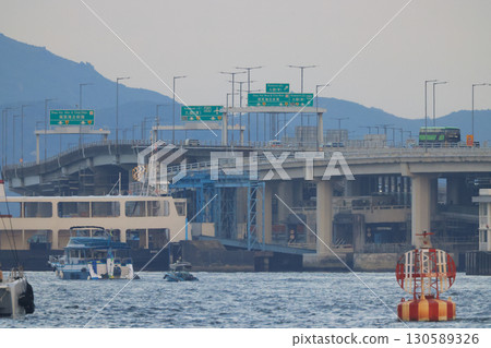 Sept 6 2025 Elevated Highway With Mountains and Traffic Signs Under Overcast Sky 130589326