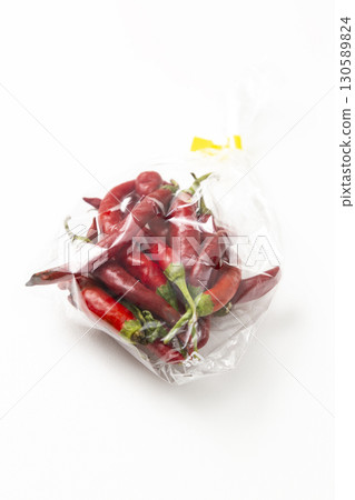 Fresh chili peppers on white background Fresh chili peppers on white background 130589824