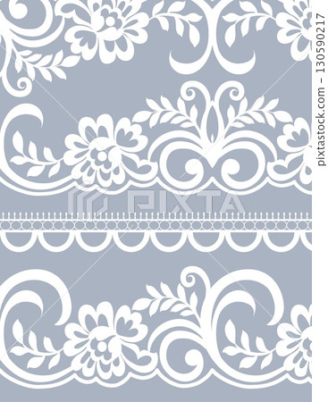 intricate white floral lace pattern on light blue background with decorative details 130590217