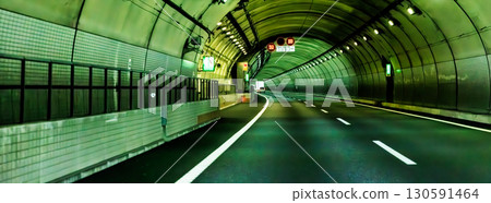 Driving through a highway tunnel Driving through a highway tunnel 130591464