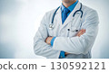 Confident medical professional in white lab coat with crossed arms and stethoscope, conveying expertise and trust against a clean, bright background, perfect for healthcare branding and medical servic 130592121