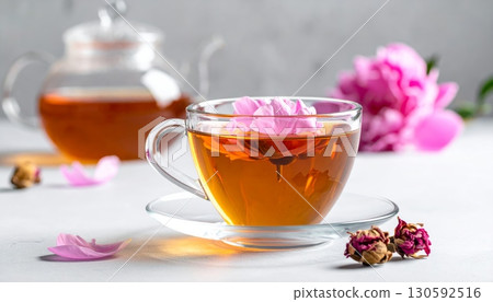 Peony Flower Tea in Clear Glass with Minimalist Background 130592516