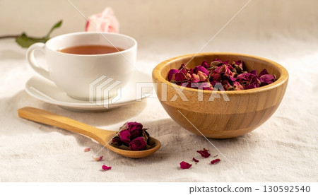 Dried Roses in Wooden Cup with Rose Tea Dried Roses in Wooden Cup with Rose Tea 130592540