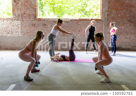 A Dynamic Group of Women Engaging in Diverse Fitness Activities in an Urban Environment A Dynamic Group of Women Engaging in Diverse Fitness Activities in an Urban Environment 130592781