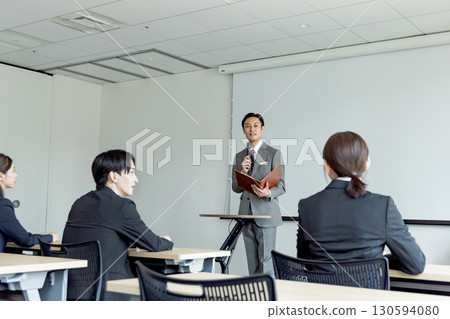 Businessmen and women participating in a seminar Businessmen and women participating in a seminar 130594080