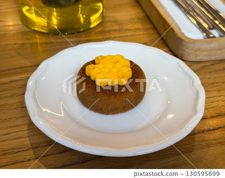 Elegant cake with honeycomb decoration. Creative dessert design and modern pastry art. 130595699