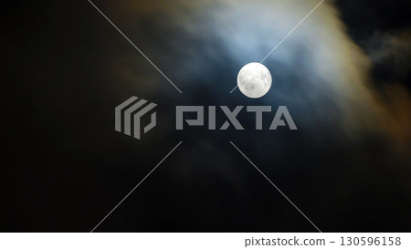 Full moon and flowing clouds Full moon and flowing clouds 130596158