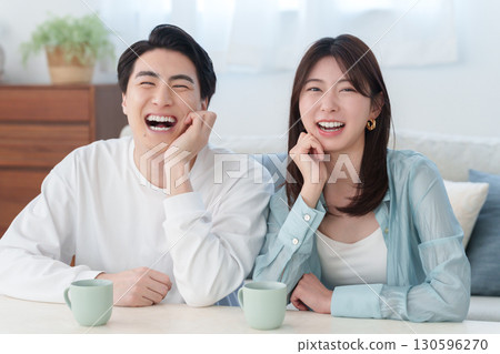 Smiling couple in a room Smiling couple in a room 130596270