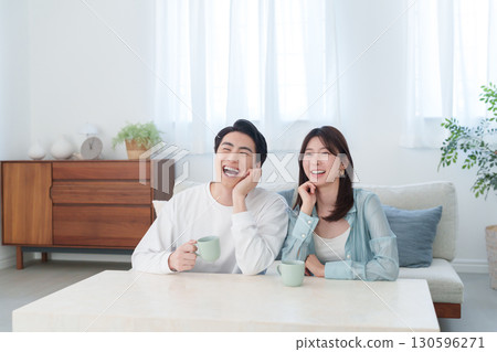 Smiling couple in a room Smiling couple in a room 130596271