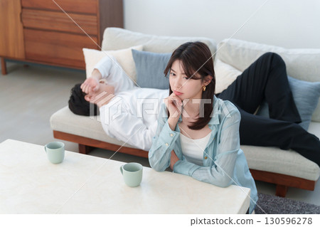 A lazy husband on a holiday and a dissatisfied wife A lazy husband on a holiday and a dissatisfied wife 130596278