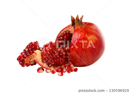 Fresh pomegranate cut open revealing bright red seeds, isolated, PNG Fresh pomegranate cut open revealing bright red seeds, isolated, PNG 130596929