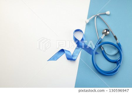 Blue ribbon for prostate cancer awareness by stethoscope Blue ribbon for prostate cancer awareness by stethoscope 130596947