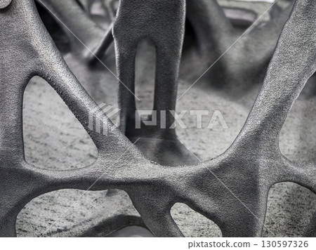 Unique black structure 3D printing showcasing intricate design and texture in a close-up view Unique black structure 3D printing showcasing intricate design and texture in a close-up view 130597326