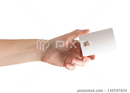A close up of a woman holding a bankcard, demonstrating cashless payment and secure fund transfer 130597834