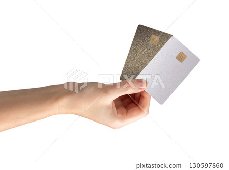 Card held in hand with chip visible. Payment, credit, cashback, salary, finance, commerce, revenue, 130597860
