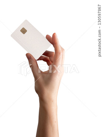 Card in female hand. Woman holding plastic bankcard with chip for salary, income, purchase, money 130597867