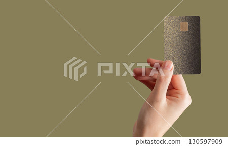 Card in hand. Female showing chip close up, concept of payment, shopping, buy, cashback, cashless, 130597909