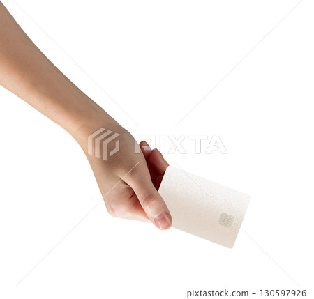 Cardholder showing a bankcard, handling credit and debit transactions for shopping. A closeup of a 130597926