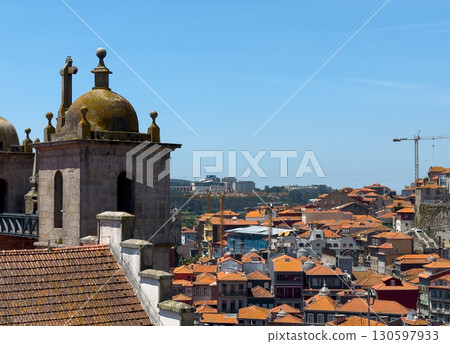 Church in Porto with dome and bell tower, historical Catholic landmark above tiled rooftops, Church in Porto with dome and bell tower, historical Catholic landmark above tiled rooftops, 130597933