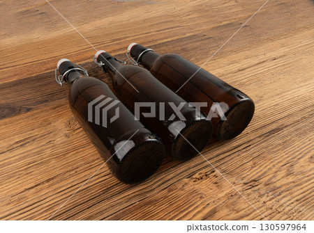 Old beer bottle, brown glass vintage beerbottle, a quality traditional time-tested drink symbol 130597964