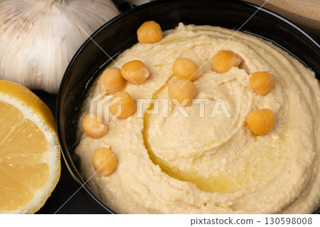 Hummus in bowl, houmous dip, chickpea humus tahini sauce, middle eastern spread 130598008