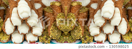 Cannoli with pistachios and ricotta. Sicilian dessert cannolo, fresh sweet cannoli pile 130598025