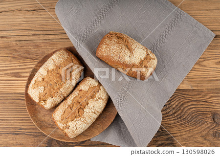 Whole wheat brown bread, fitness pumpkin carrot buns with seeds, cereal bread grain bun Whole wheat brown bread, fitness pumpkin carrot buns with seeds, cereal bread grain bun 130598026