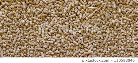 Wood cat litter textured background. Compressed sawdust pellets pattern top view 130598046