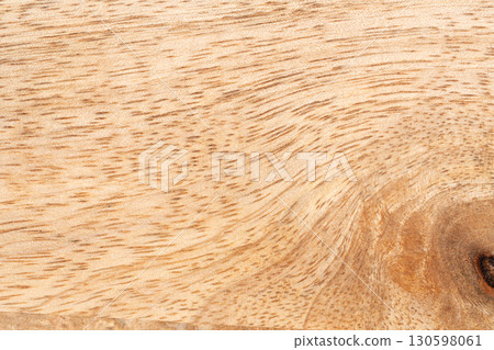 Mango wood texture top view. Kitchen wooden tray background, organic Mangifera indica veneer Mango wood texture top view. Kitchen wooden tray background, organic Mangifera indica veneer 130598061