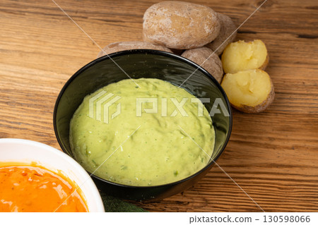 Red mojo rojo and green mojo verde sauces, traditional Tenerife dips, mojo picon dressing Red mojo rojo and green mojo verde sauces, traditional Tenerife dips, mojo picon dressing 130598066