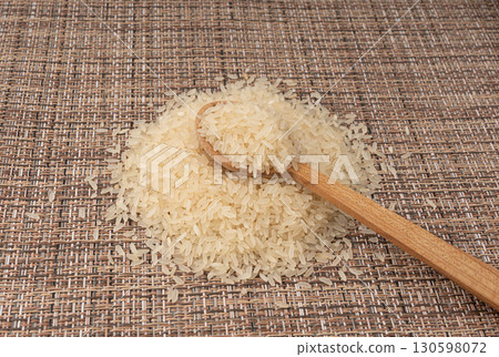 White parboiled rice grains. Dry uncooked ponni rice, small organic basmati White parboiled rice grains. Dry uncooked ponni rice, small organic basmati 130598072