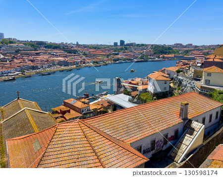 Panoramic view of Porto and Vila Nova de Gaia with Douro River, sailing boats, red tile rooftops in 130598174