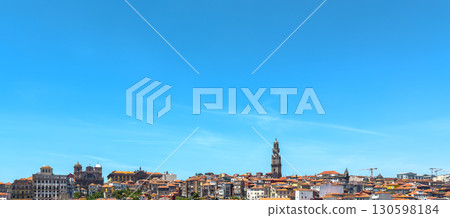 Porto cityscape with Clerigos tower, traditional rooftops, red tiles, baroque architecture, dense 130598184