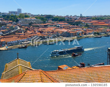 Porto cityscape with Douro River and cruise boats, scenic waterfront view of historic buildings and 130598185
