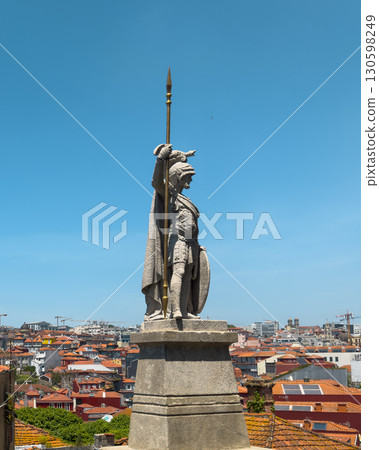 Statue sculpture of Roman warrior soldier with helmet, armor, cape, spear, shield, stone pedestal. Statue sculpture of Roman warrior soldier with helmet, armor, cape, spear, shield, stone pedestal. 130598249