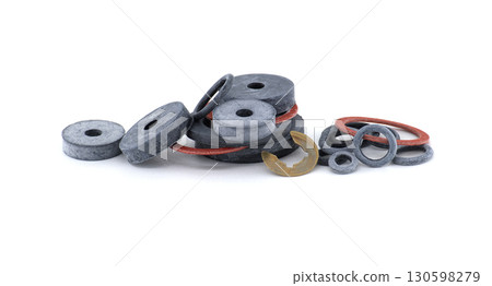 Various rubber gaskets and washers displayed neatly on a white background, showcasing their forms. 130598279