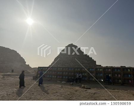 The unfinished step pyramid, desert and sun in Cairo, Egypt. The unfinished step pyramid, desert and sun in Cairo, Egypt. 130598659
