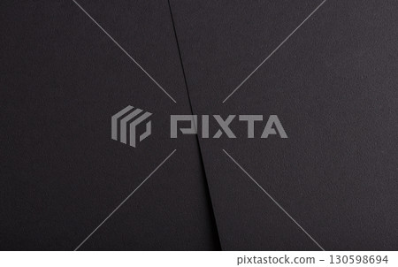 Abstract designer paper texture with dark, monochrome backdrop. Elegant, premium surface with deep 130598694