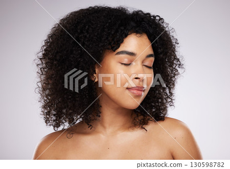 Beauty, black woman and skincare with cosmetics, dermatology and foundation against grey studio background. African American female, lady and makeup with healthy, smooth and clear skin with grooming Beauty, black woman and skincare with cosmetics, dermatology and foundation against grey studio background. African American female, lady and makeup with healthy, smooth and clear skin with grooming 130598782