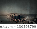 Wooden natural podium, dry roses buds and decorative driftwood on the table, copy space, gloomy mood. 130598799