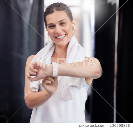 Smart watch, woman and earphones in gym for exercise, fitness and wireless tech. Stopwatch, portrait and happy female with time, wellness and check healthy sports progress on clock, data app or music Smart watch, woman and earphones in gym for exercise, fitness and wireless tech. Stopwatch, portrait and happy female with time, wellness and check healthy sports progress on clock, data app or music 130598828
