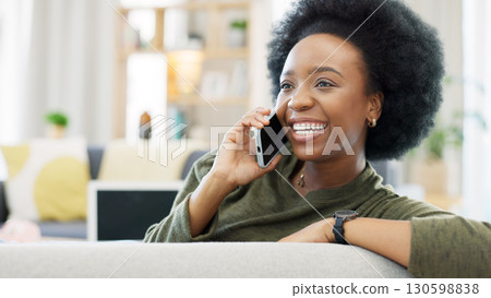 Black woman, smartphone and happy conversation in home for news, mobile contact and communication on sofa. Phone call, hello and smile for discussion with social networking, chat or talking of gossip 130598838