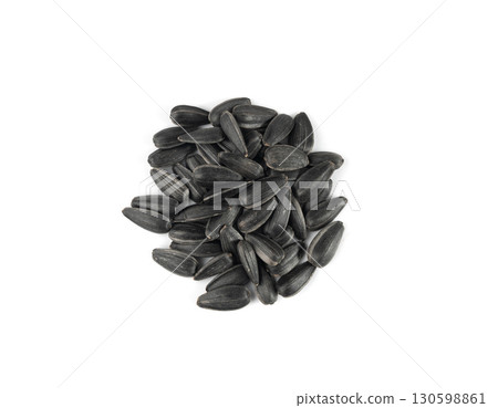 Sunflower seeds pile isolated, black oil sun flower grains group with shell, fresh edible oil seeds heap 130598861