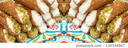 Cannoli with pistachios and ricotta. Sicilian dessert cannolo, fresh sweet cannoli pile 130598867