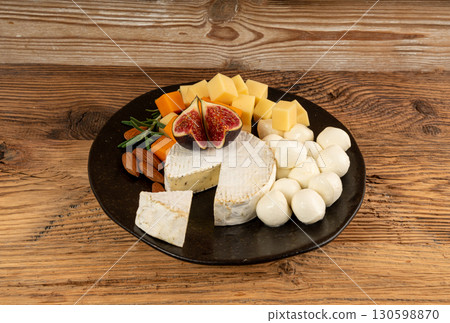 Cheese plate of color cheeses variety, yellow, white and blue cheese board, assorted dairy products 130598870