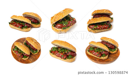Choripan Sausage Sandwich Isolated, Traditional Chimichurri Bread with Chorizo and Chimichurri Choripan Sausage Sandwich Isolated, Traditional Chimichurri Bread with Chorizo and Chimichurri 130598874