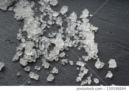 Dead sea salt pile, white crystals for body spa, sodium chloride similar to crushed ice, spa scrub 130598884