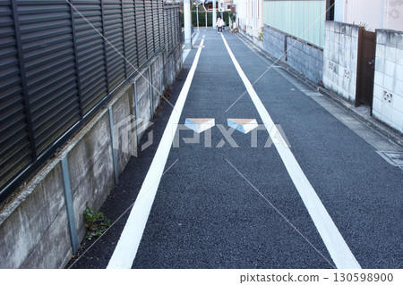 Road markings encouraging drivers to slow down (image humps) Road markings encouraging drivers to slow down (image humps) 130598900
