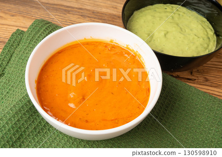 Red mojo rojo and green mojo verde sauces, traditional Tenerife dips, mojo picon dressing Red mojo rojo and green mojo verde sauces, traditional Tenerife dips, mojo picon dressing 130598910